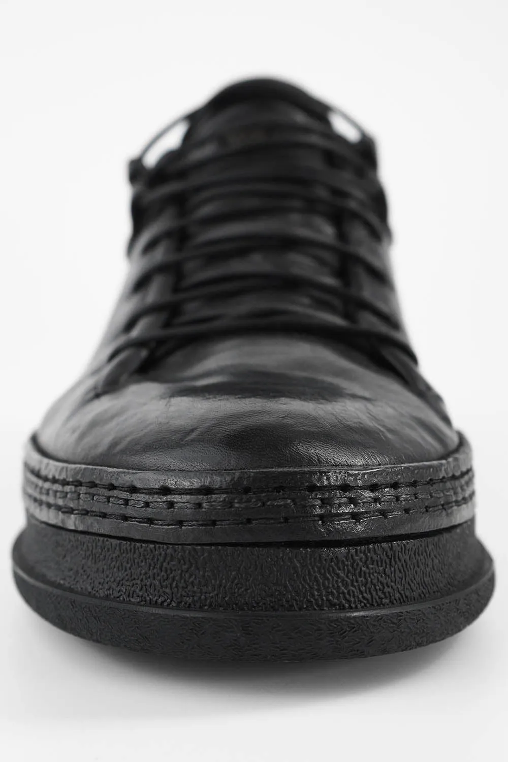 COLE rugged-black welted distressed sneakers.